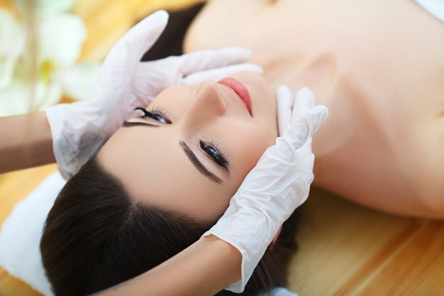 Young woman lying on a massage table