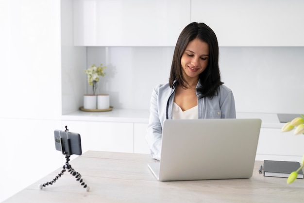 Young woman making a vlog at home