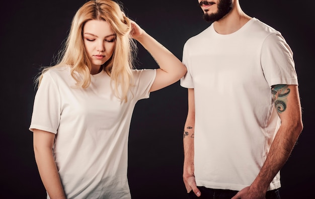 Young woman and man in blank white shirt