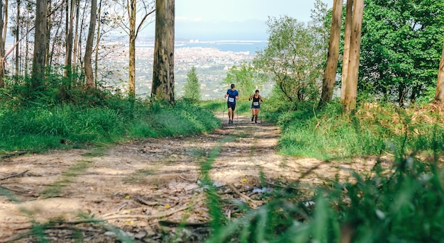 Young woman and man doing trail