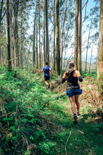 Young woman and man doing trail