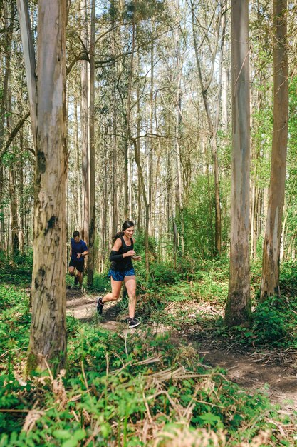 Young woman and man doing trail