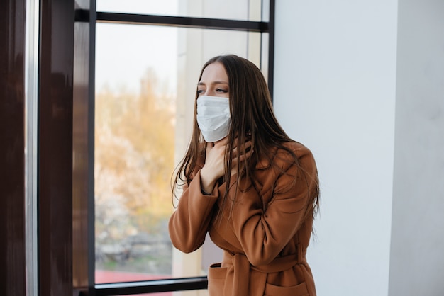 Young woman in a mask during the pandemic and coronovirus