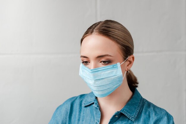 Young woman in medical mask, coronavirus concept