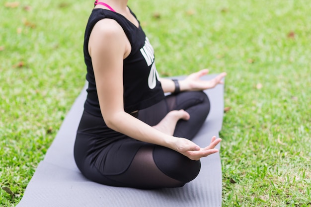 Young woman meditating in nature