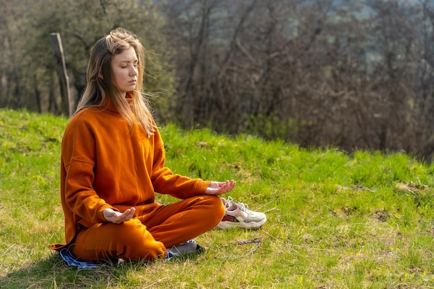 Young woman meditating yoga on the mountain Relax and calm