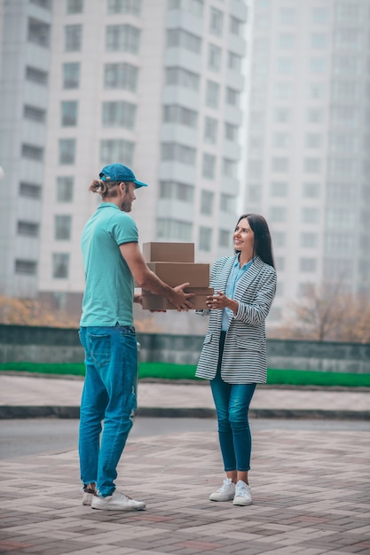 Young woman meeting the delivery man