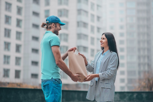 Young woman meeting the delivery man