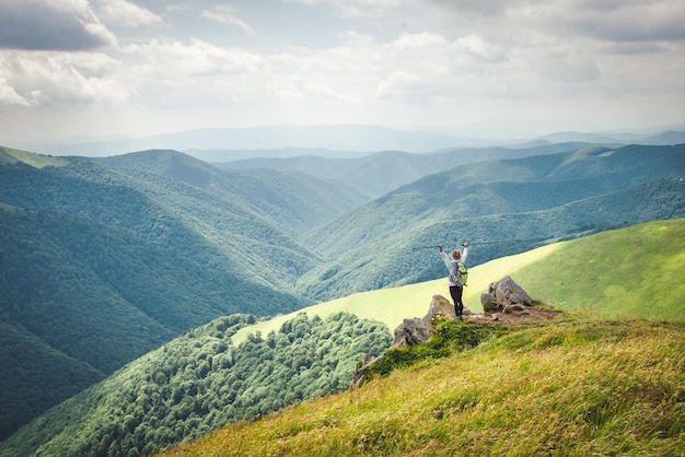 Young woman n the top of the mountains