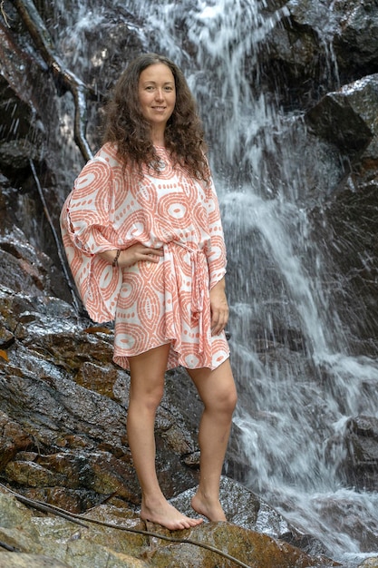 Young woman near waterfall island Koh Phangan Thailand