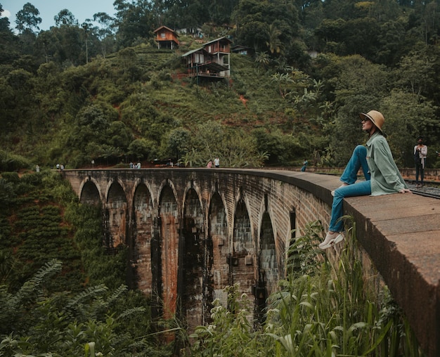 Young woman on the ninearch bridge