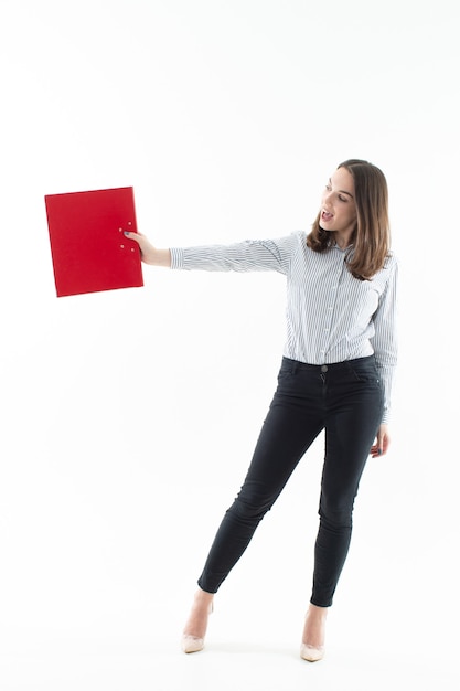 Young woman in an office dress code with a red folder