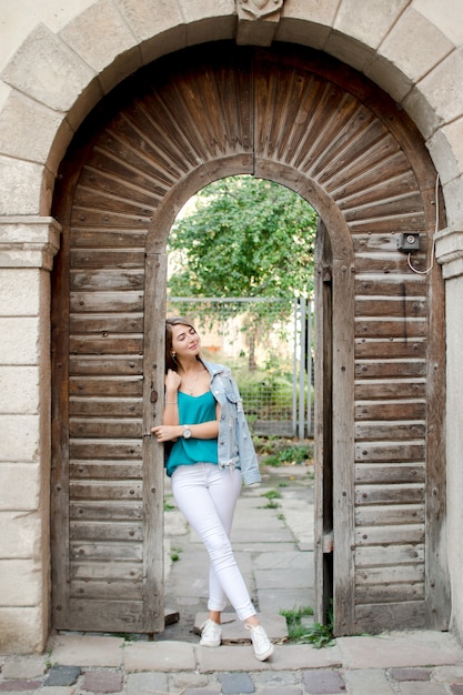 Young woman in old town