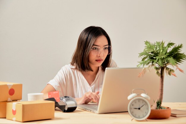 Young woman online seller working from home