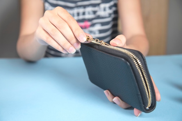 The young woman opening wallet