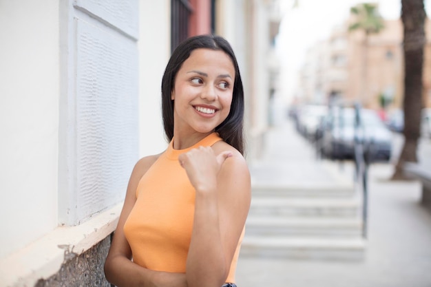 young woman outdoors with a copy space