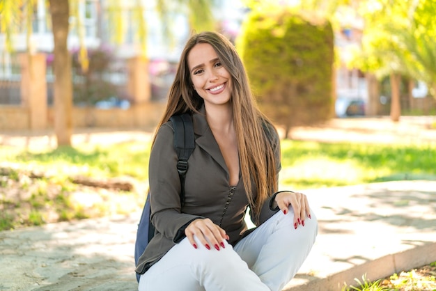 Photo young woman at outdoors with happy expression