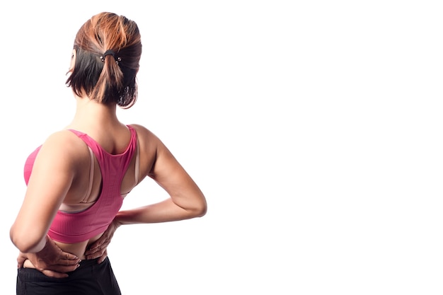 Young woman pain at lower back, woman holding two hand on lower back muscle area with pain action