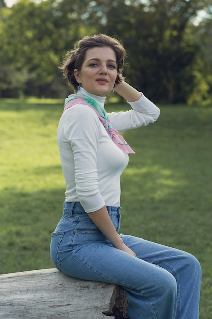 Young woman in the park Cute girl portrait in french style