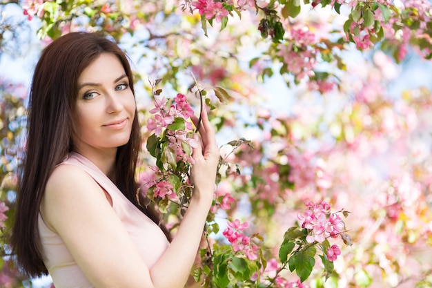 Young woman in the park in the spring