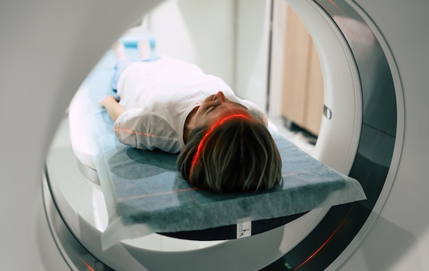 Young woman patient is ready to do magnetic resonance