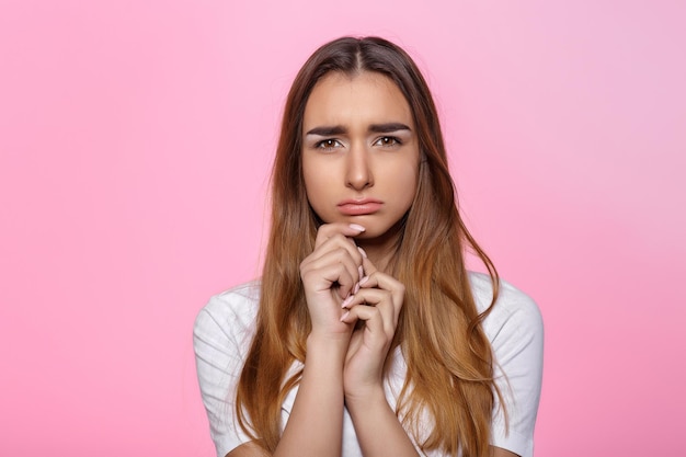 Young woman on pink background Attractive beautiful woman showing air kiss