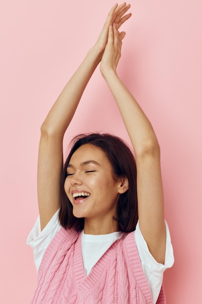 Young woman in a pink vest posing casual wear Lifestyle unaltered