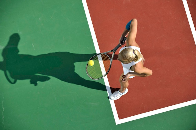 young woman play tennis outdoor