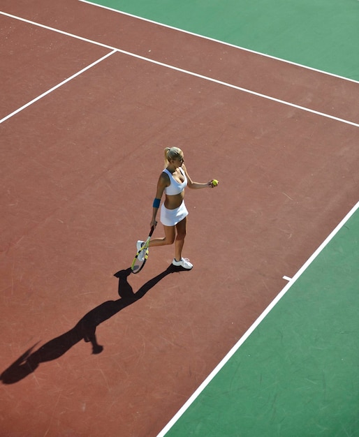 young woman play tennis outdoor