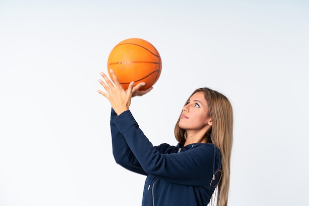 Young woman playing basketball