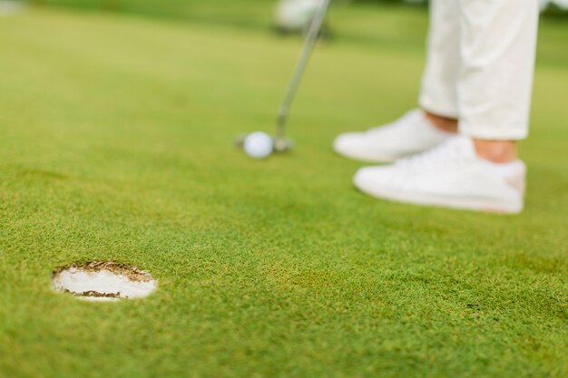 Young woman playing golf