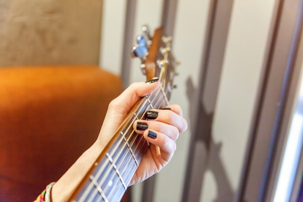 Young woman playing guitar