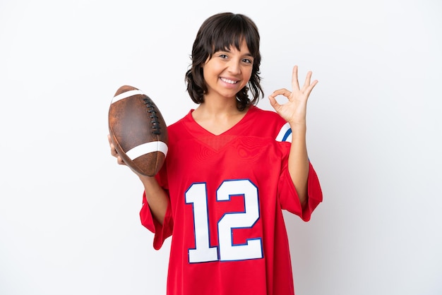 Photo young woman playing rugby isolated on white background showing ok sign with fingers