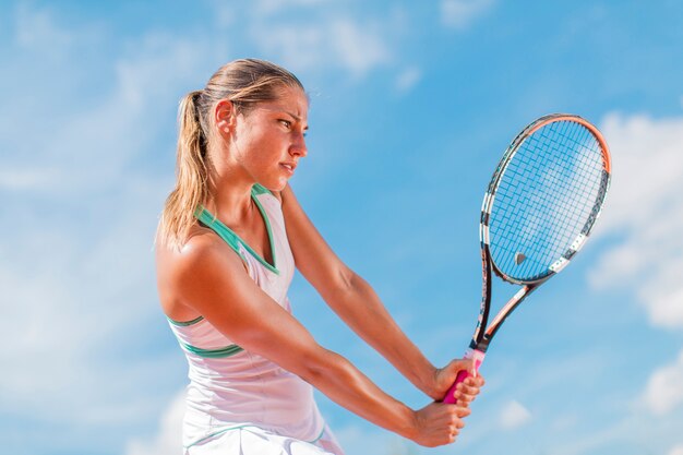 Young woman playing tennis