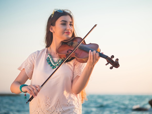 Young woman playing the violin