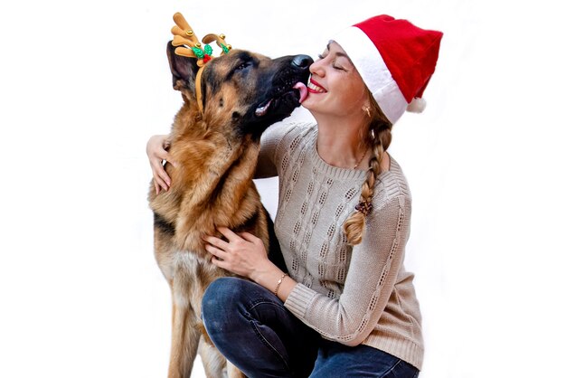 Young woman playing with German shepherd