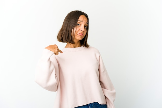 Young woman pointing at herself