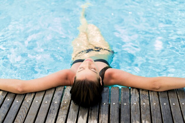 Young woman in the pool