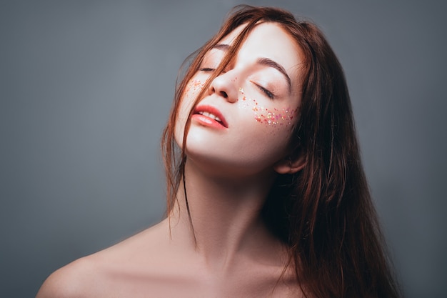 Young woman portrait. Freedom of solitude. Calm and peace. Redhead female with eyes closed