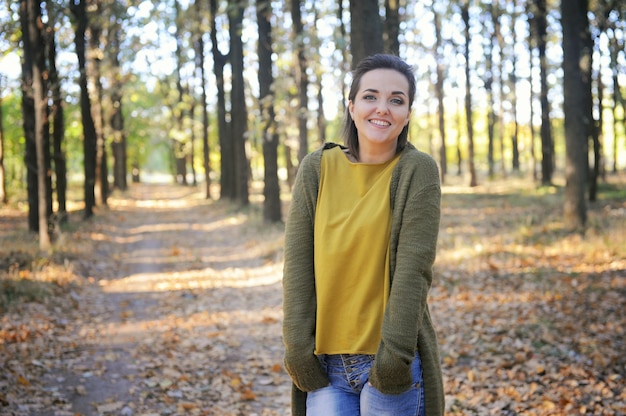 Young woman portrait, rest in autumn park