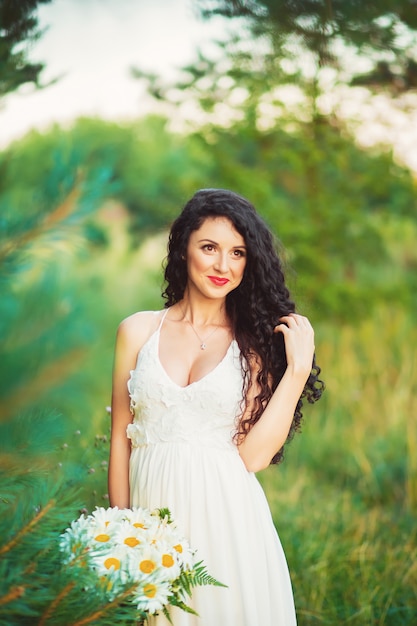 A young woman posing on a field