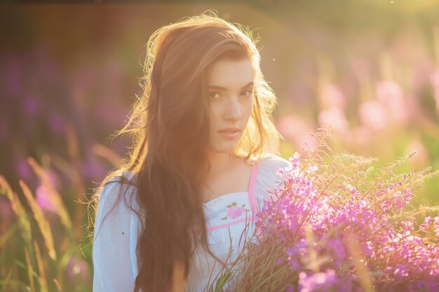 A young woman posing on a field