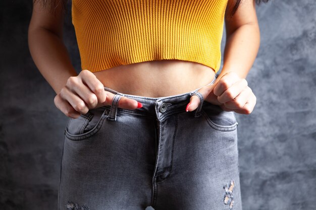 Young woman posing in jeans