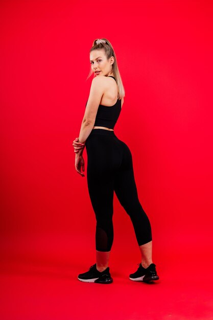 Young woman posing in the studio advertising sportswear and yoga wear healthy lifestyle sport