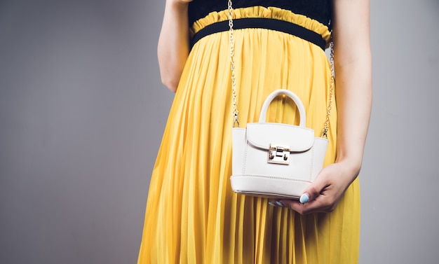 Young woman posing with bag