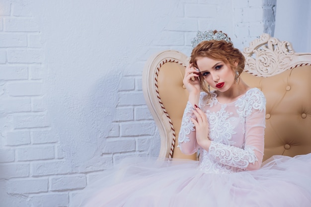 Young woman posing with beautiful wedding dress