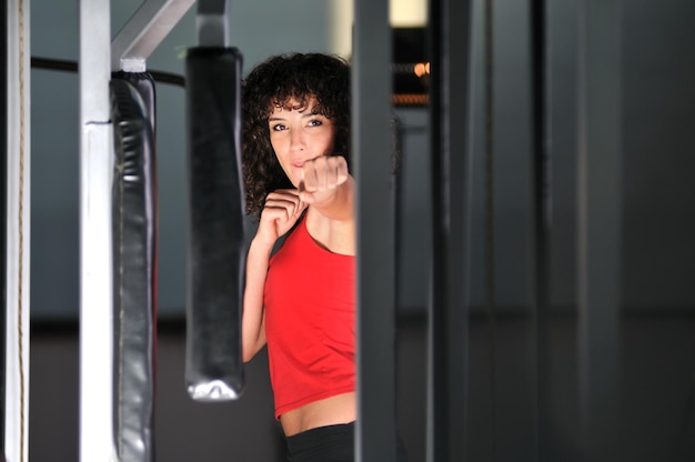 young woman practicing fitness and working out in a gym