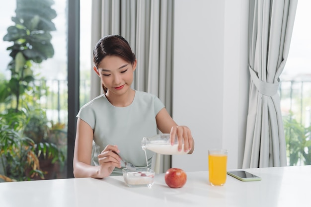 Young woman prepares a lowcalorie breakfast on a prescription