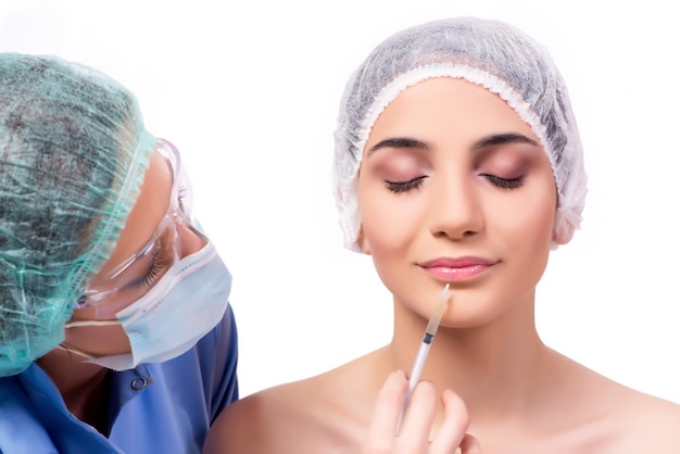 Young woman preparing for plastic surgery isolated on white