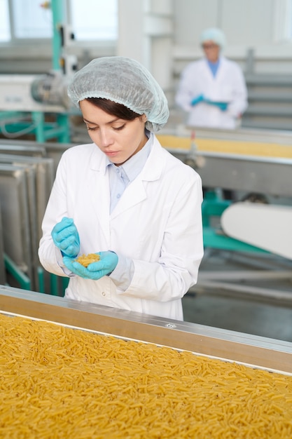 Young woman at production line